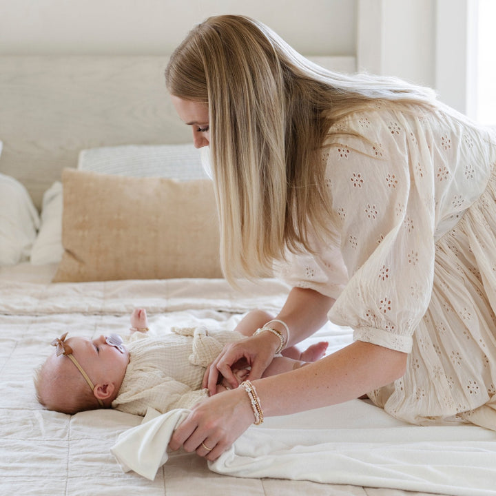 Saranoni Minky Stretch Luxe Swaddle/Blanket in Apple easily replaces a cotton blanket thanks to its incredible stretch and softness.