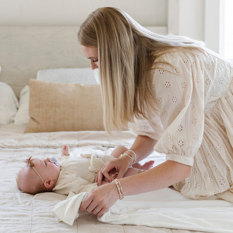 Saranoni Minky Stretch Luxe Swaddle/Blanket in Apple easily replaces a cotton blanket thanks to its incredible stretch and softness.