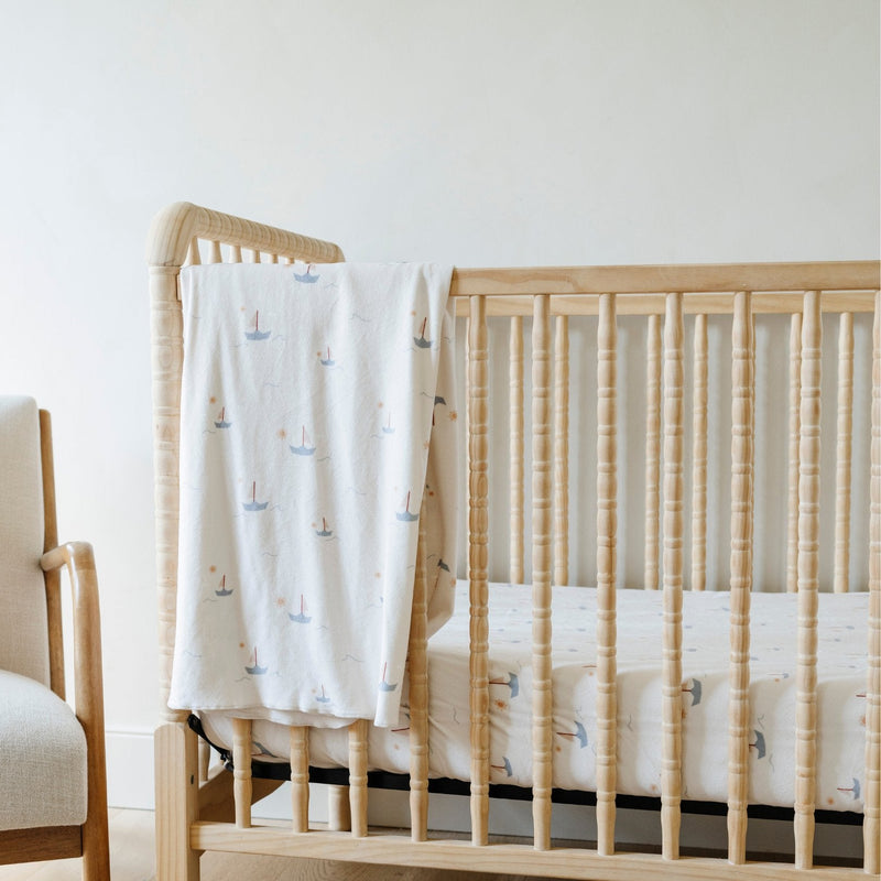 New parents love the Saranoni Minky Stretch Luxe Swaddle/Blanket in Boats for everyday comfort as a baby blanket.