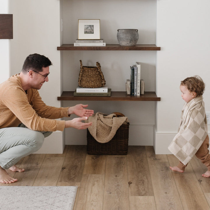 SaranoniÕs Minky Stretch Receiving Blanket in Neutral Checkered offers plush softness that makes it one of the best baby blankets around.