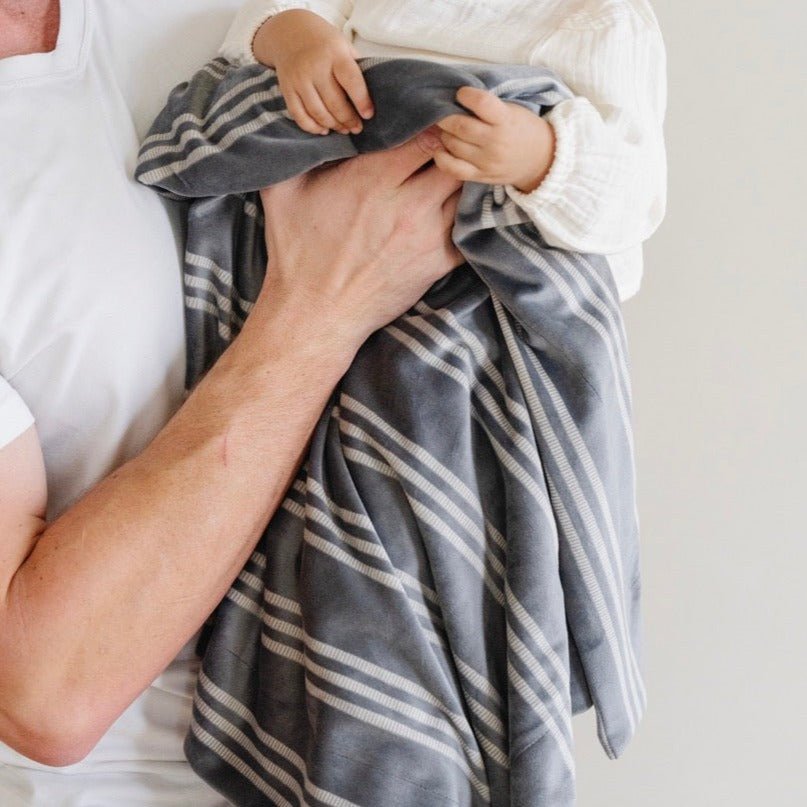 SaranoniÕs Minky Stretch Receiving Blanket in Stripe makes an excellent infant receiving blanket for peaceful naps.