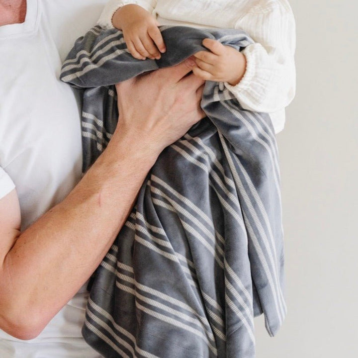 SaranoniÕs Minky Stretch Receiving Blanket in Stripe makes an excellent infant receiving blanket for peaceful naps.