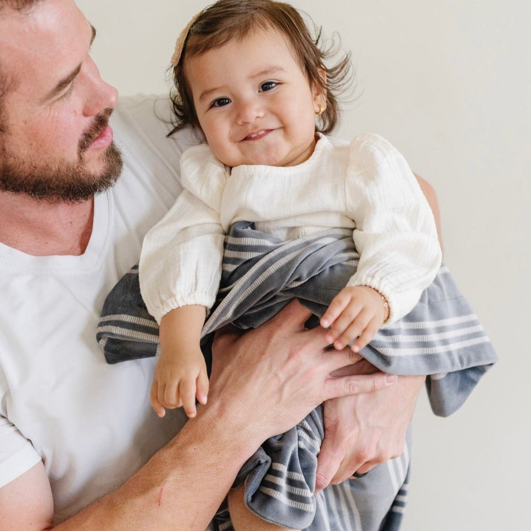 Experience luxury with the Saranoni Minky Stretch Receiving Blanket in Stripe, one of the best baby blanket options available.