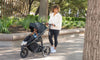 woman outside with baby in bob gear wayfinder jogging stroller