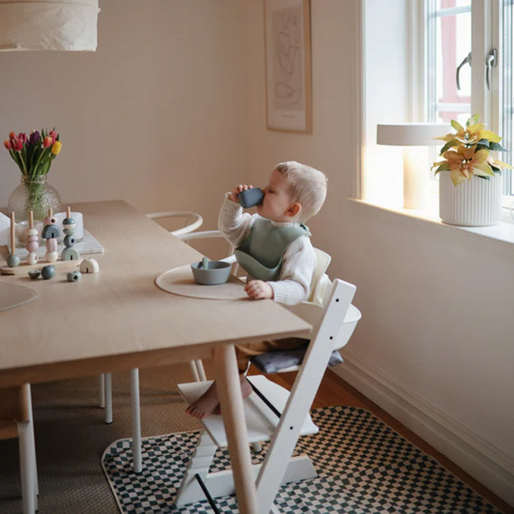 Soft blush silicone starter cup by Uppababy, baby safe and easy to hold.