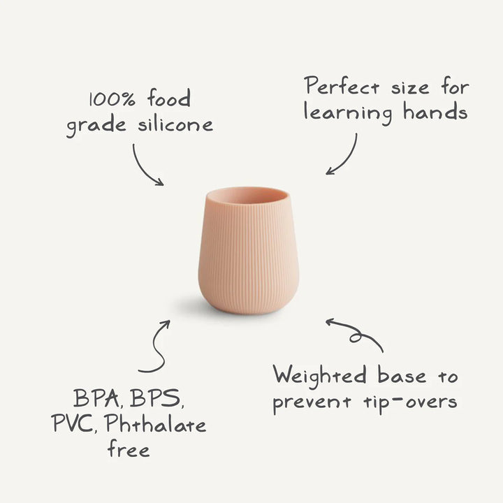 Feeding time with Uppababy mushie silicone starter cup in Blush, baby safe for daily use.