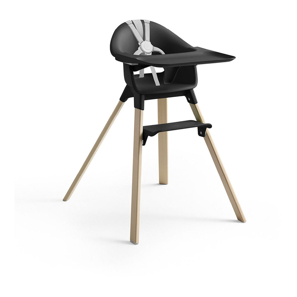 stokke clikk highchairs in black with natural legs