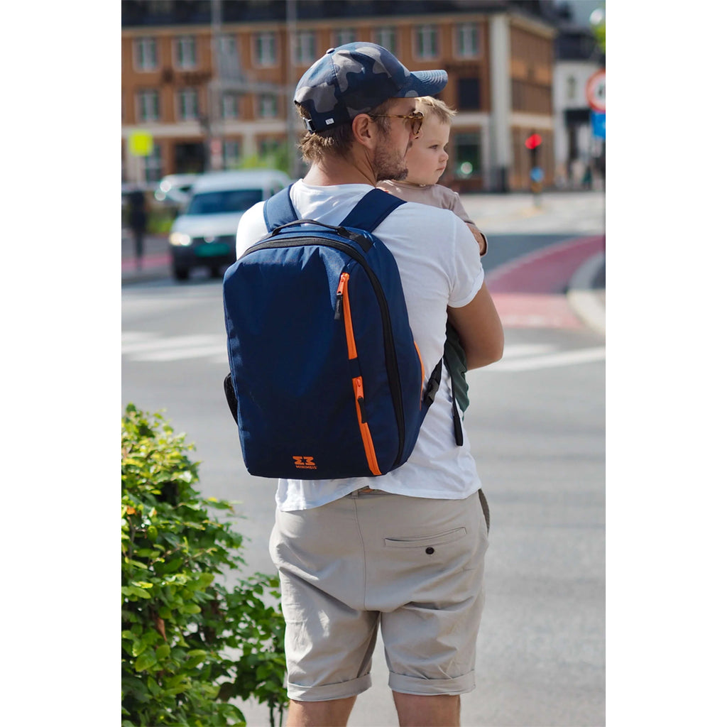 A father using the backpack in navy outdoors