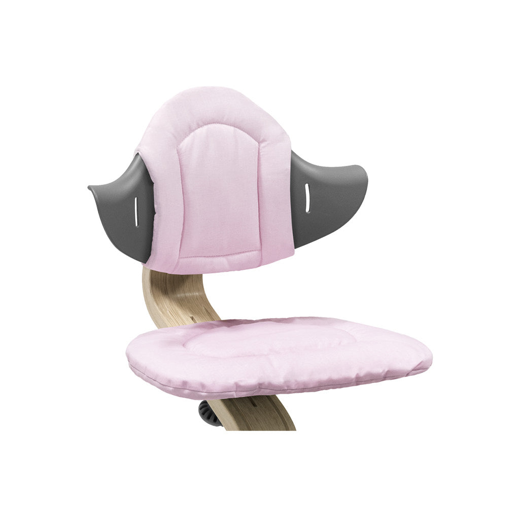 pink cushion on stokke nomi best high chair