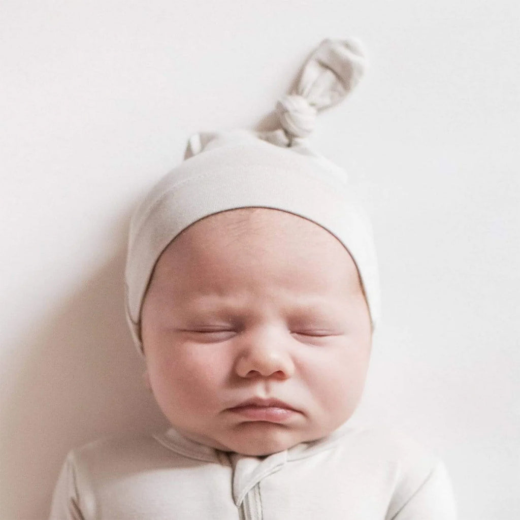 newborn baby photos with Kyte Baby cloud knotted cap