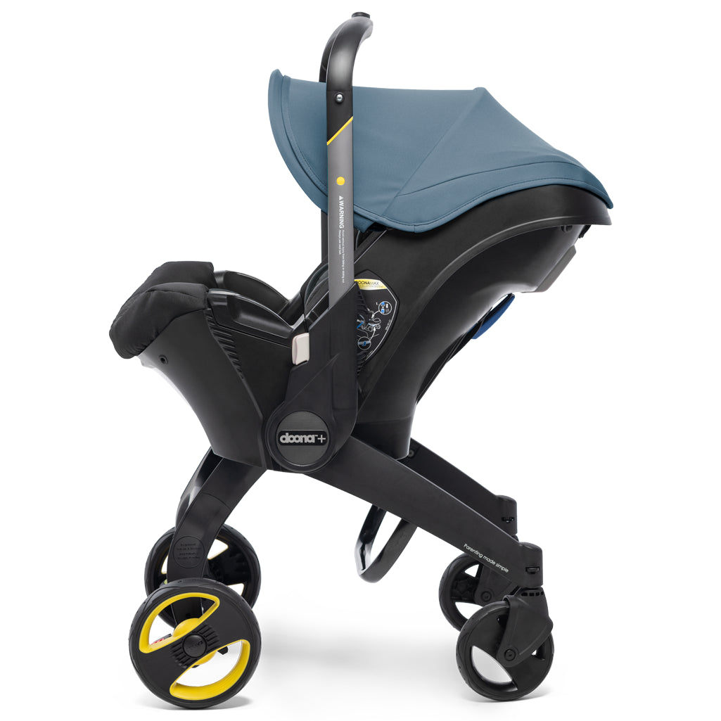 doona stroller with baby car seat in blue