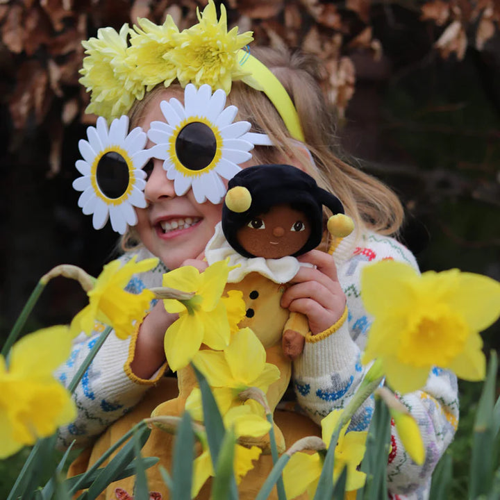 yellow olli ell billie dinky bumble bee with child in field of daffadils 