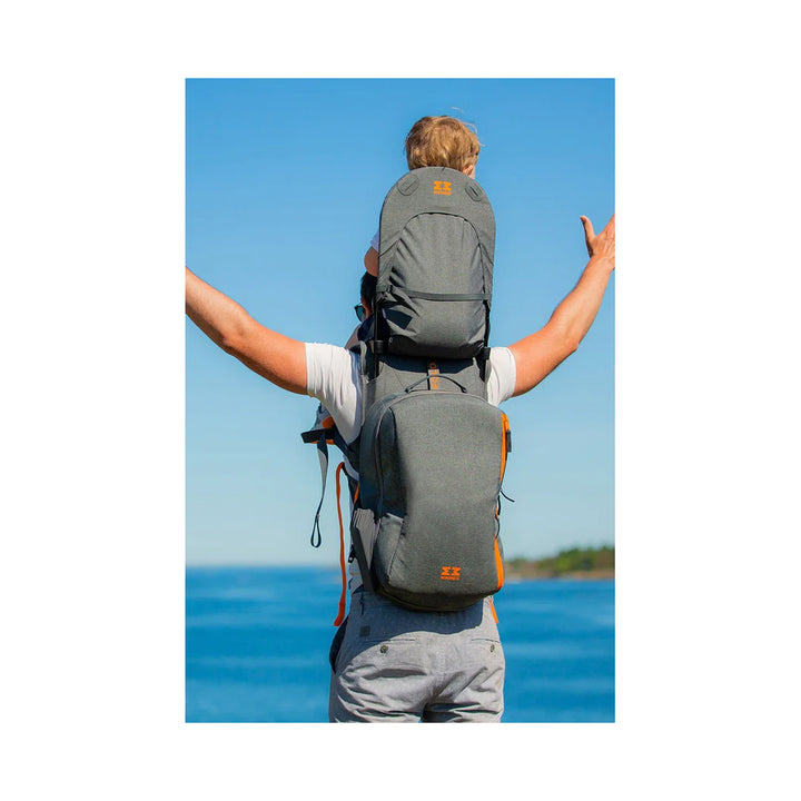 The backpack in grey melange being enjoyed outside