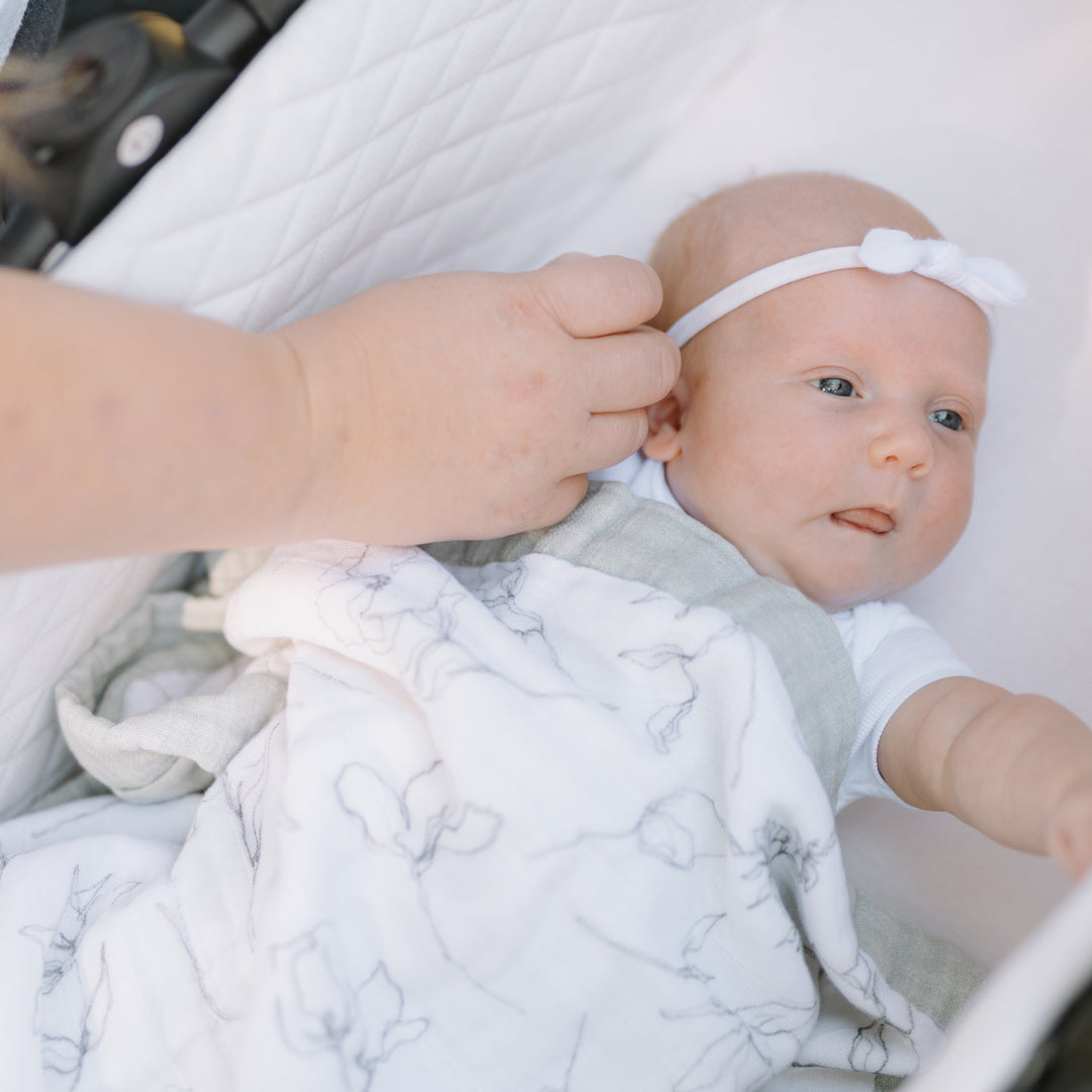Little Unicorn Organic Cotton Muslin Baby Quilt - Pencil Floral draped gracefully, a charming baby quilt with delicate floral details and softness.