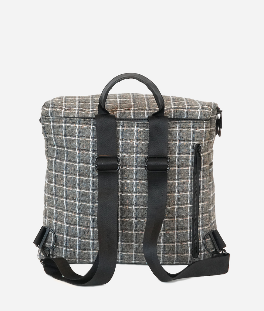 The Original Diaper Bag in Plaid Tweed can be worn as a messenger bag or a backpack