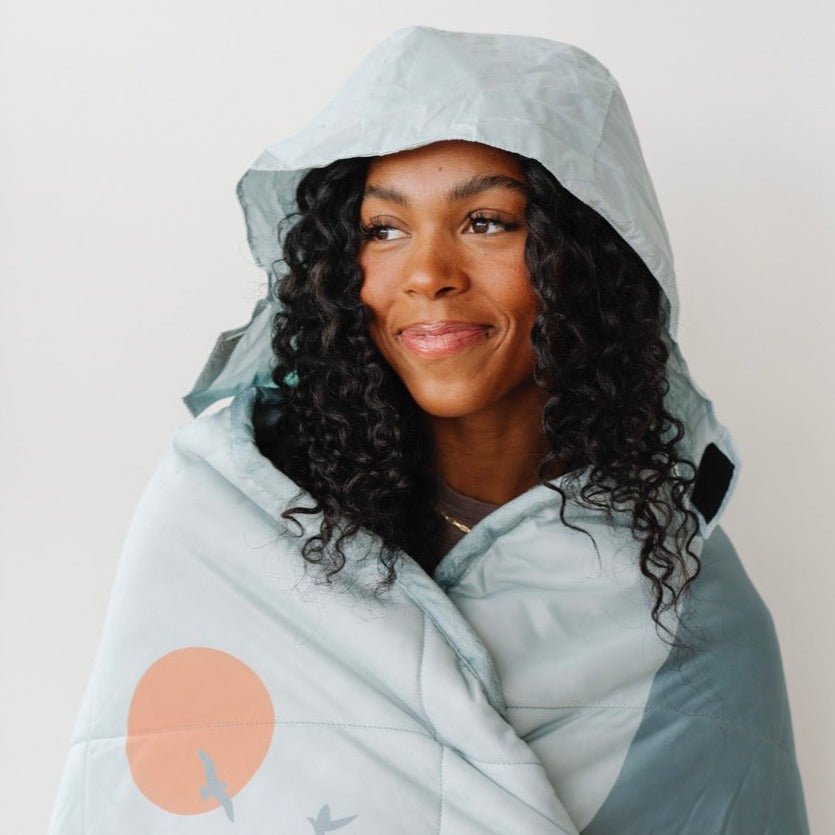 Toddlers stay cozy using the Saranoni Outdoor Blanket Glacier, a best blanket for toddler adventures.