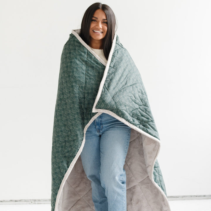 The Saranoni Outdoor Blanket in Valley is perfect for travel, play, and naps, a top baby blanket pick.