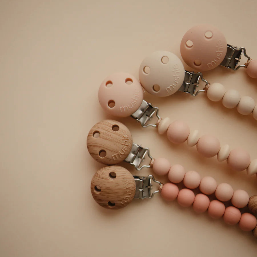 Mushie Eva pacifier holder collection