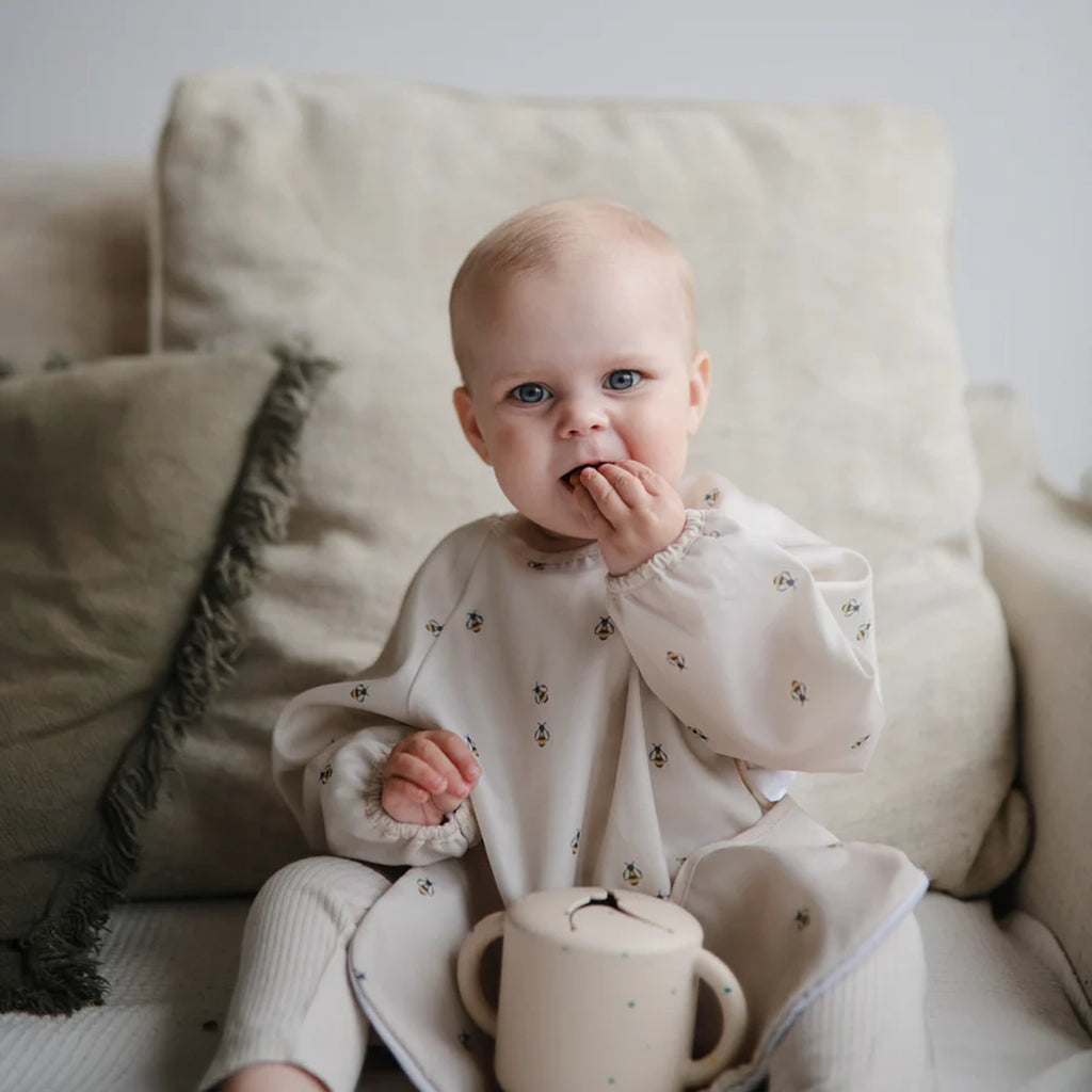 Mushie long sleeved bib with bees