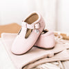 Little Love Bug shoes in the scalloped T-bar style, in the color pink.