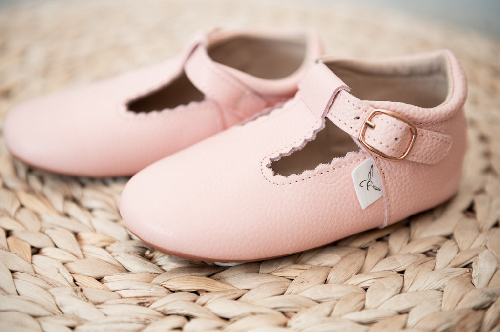 Little Love Bug Company pink leather shoes in the t-bar style.