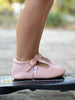 Side photo of Little Love Bug Company T-bar shoes in pink