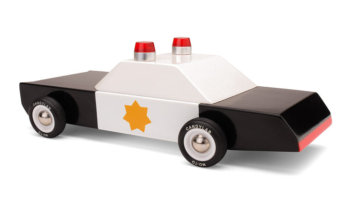 Plantoys Police Cruiser displayed in a diagonal rear view, styled for kids who enjoy small toy cars adventures.