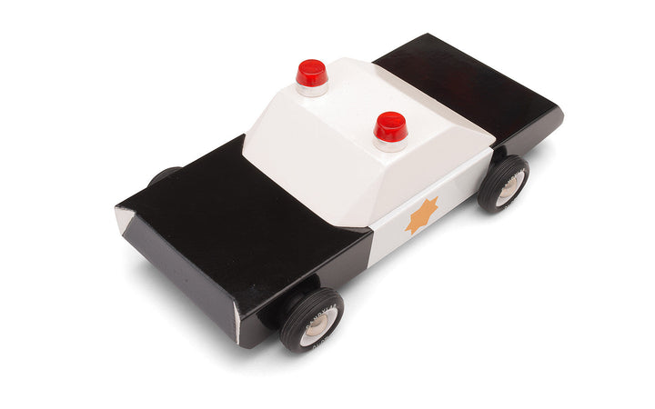 A top-down angle highlights the Plantoys Police Cruiser as a sturdy wooden toy car built for everyday fun.