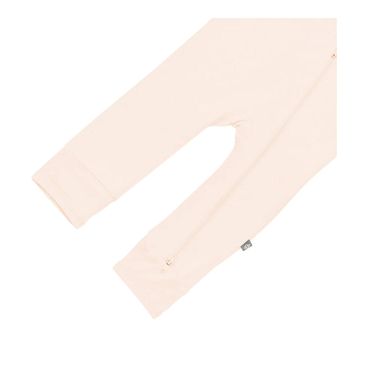 Kyte Baby Zipper Romper in the color porcelain.