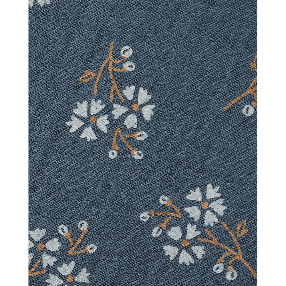 close up of dark blue floral quincy mae bandana 