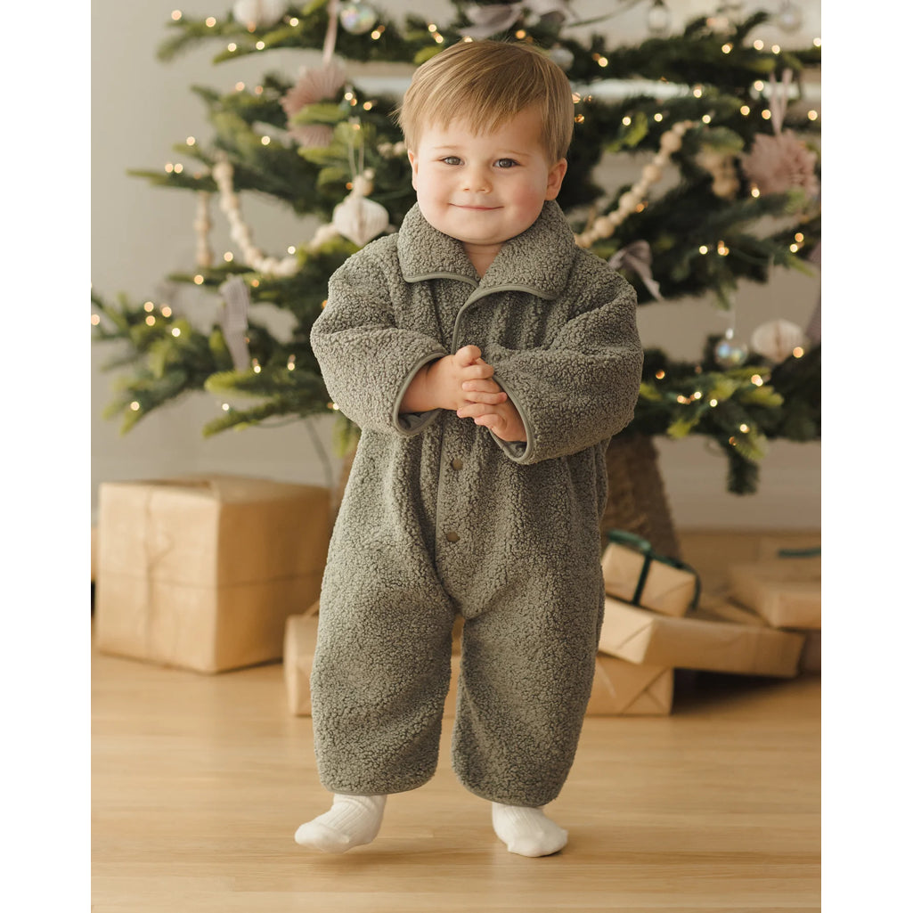 baby experiencing christmas in shearling green forest button up quincy may baby coat 