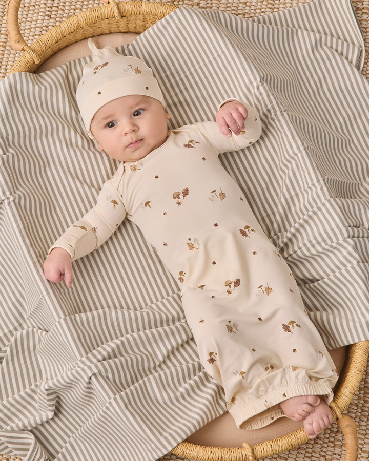 Woodland bamboo baby gown and knotted hat by Quincy Mae, studio photo