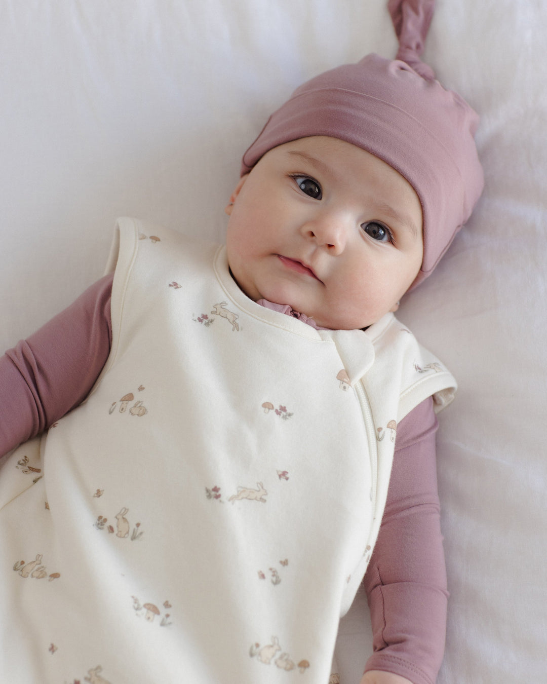Lifestyle photo of the Mulberry Bamboo Knotted Baby Hat by Quincy Mae
