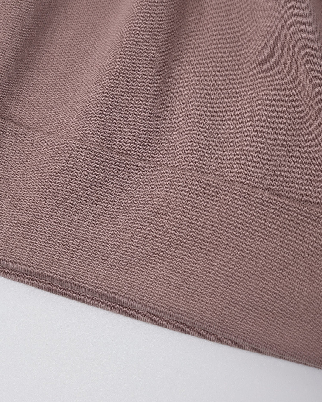 Detail of the Quincy Mae Bamboo Knotted Baby Hat in Mulberry, stretchy bamboo fabric