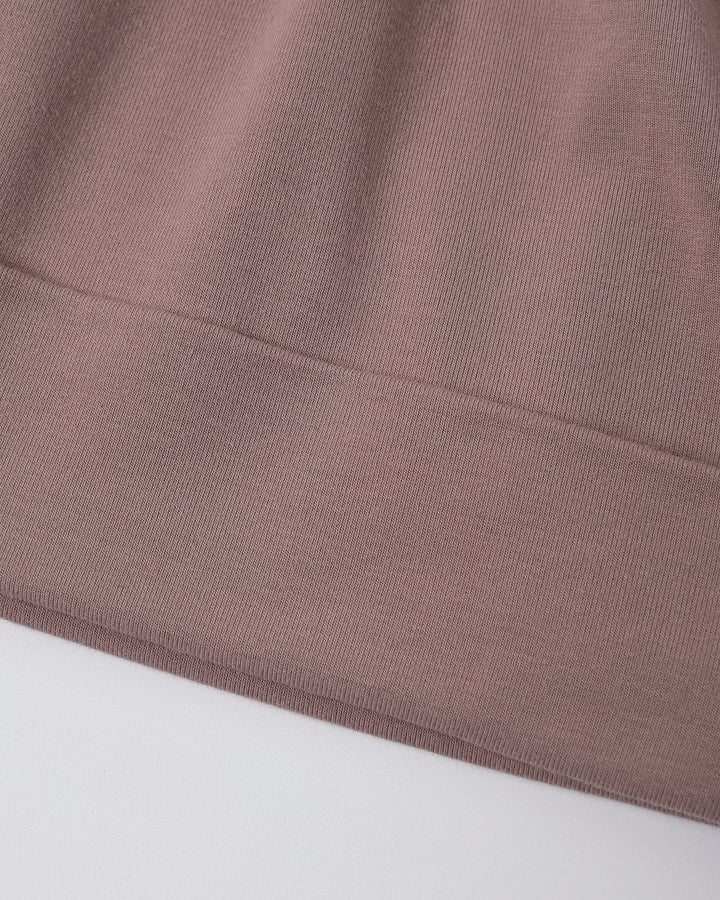 Detail of the Quincy Mae Bamboo Knotted Baby Hat in Mulberry, stretchy bamboo fabric