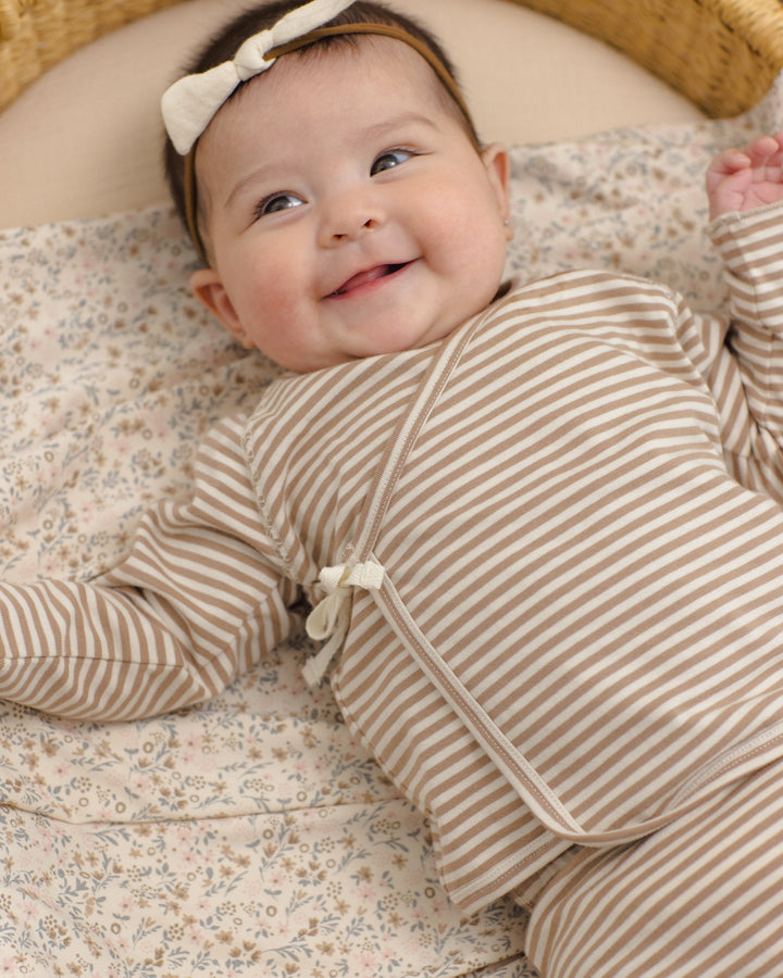 Lifestyle photo of the Quincy Mae Bloom Bamboo Swaddle, baby shower gift idea