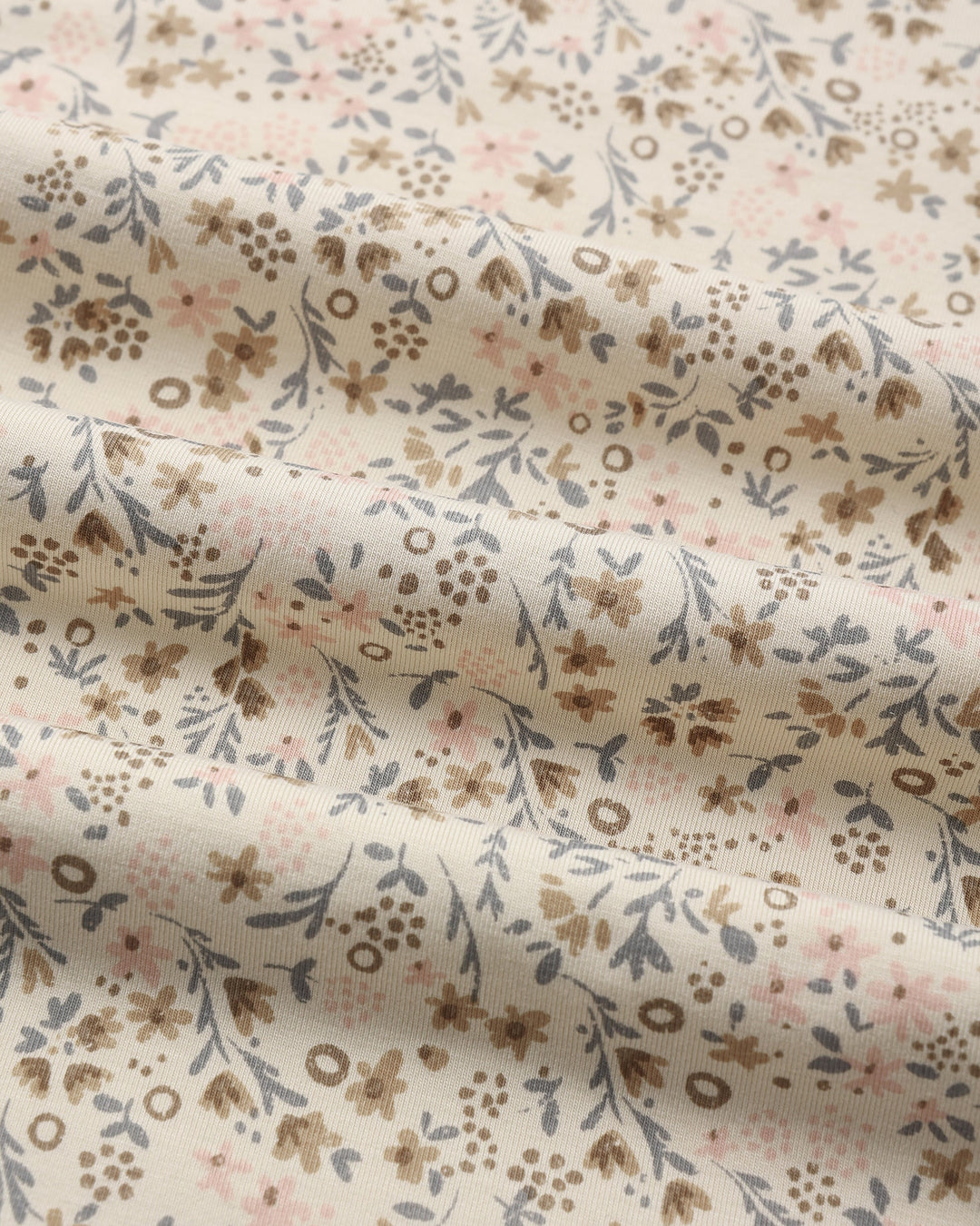 Detail of the Bloom print, Quincy Mae Bamboo Swaddle in natural, stretchy bamboo fabric