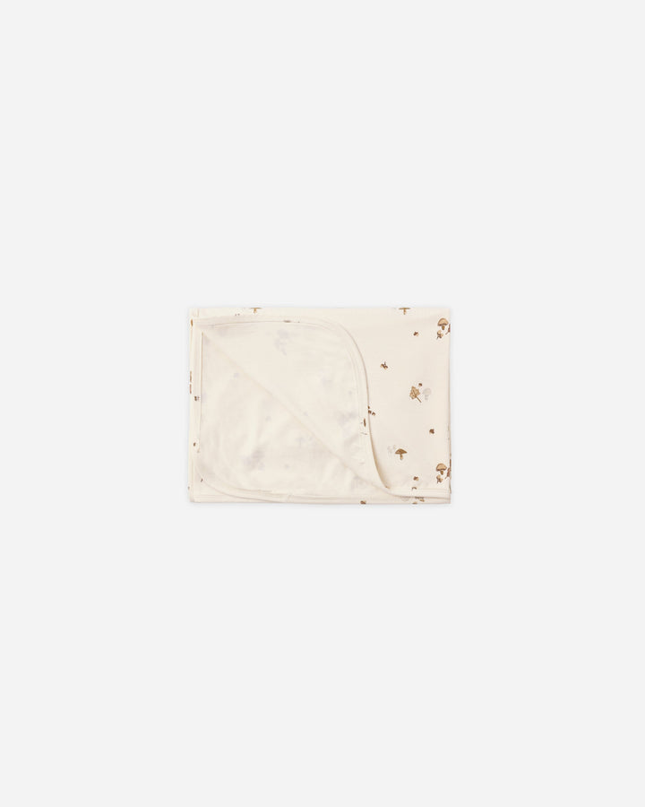 Quincy Mae Bamboo Swaddle in Woodland print on natural, soft stretchy baby swaddle blanket 42 x 42
