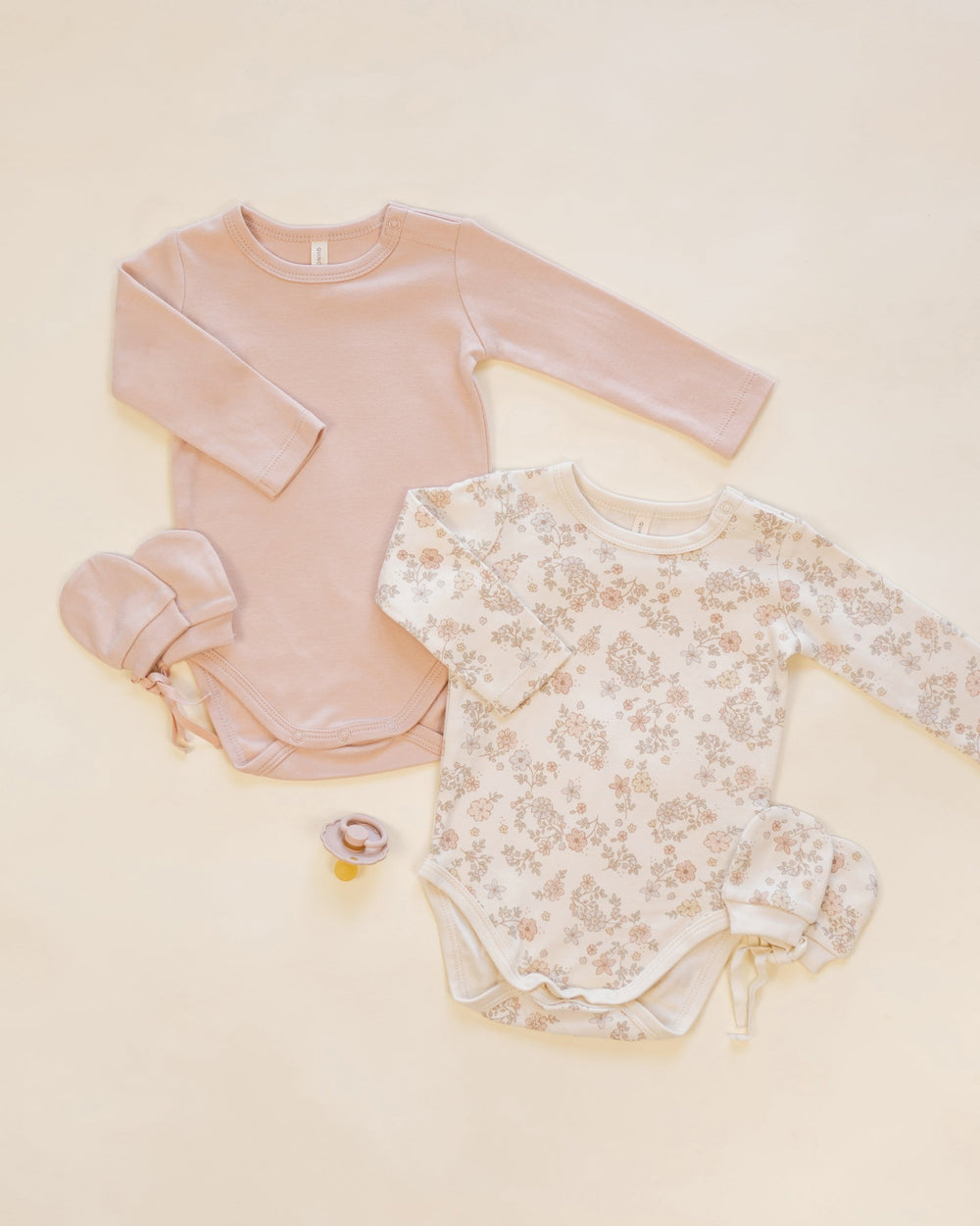 Styled flat lay with Quincy Mae Floral Vine no scratch newborn mittens