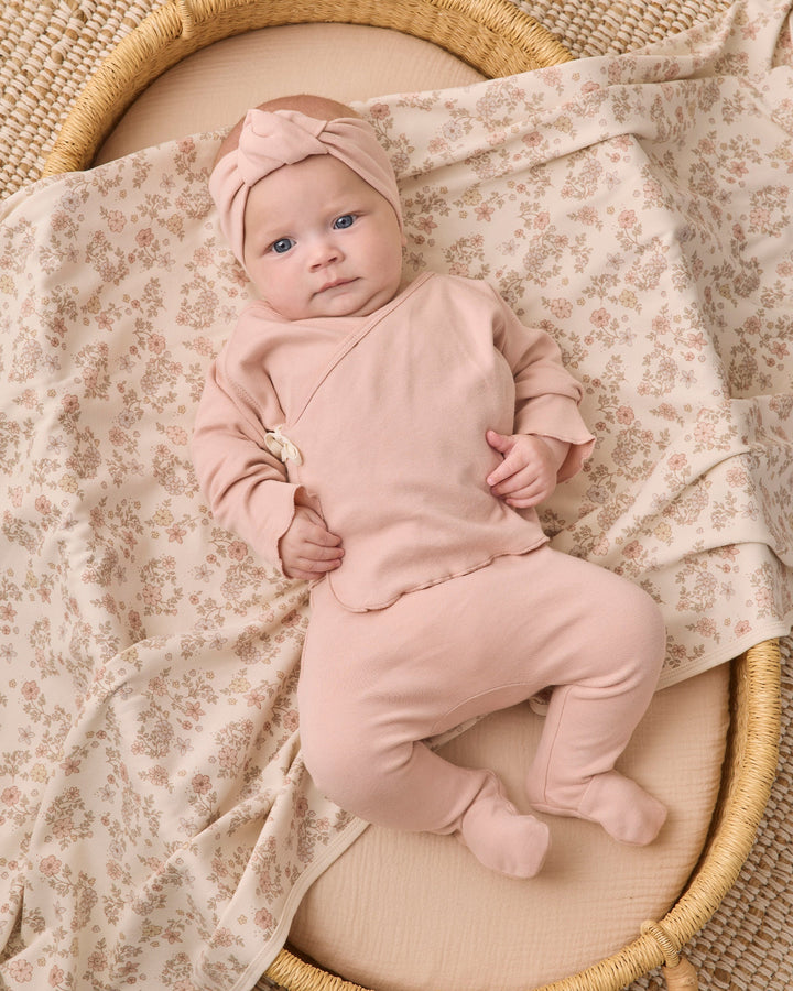 Studio photo of the Quincy Mae Floral Vine Swaddle, soft brushed jersey baby shower gift