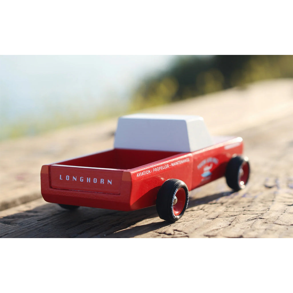 Longhorn truck wooden toy by Candylab, perfect for adventurous pretend play.