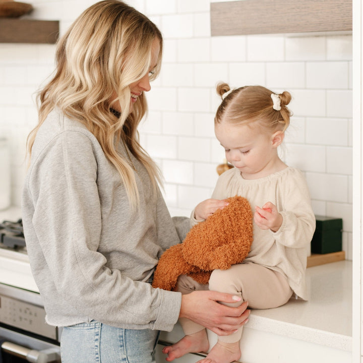 In Ginger, the Saranoni Ribbed BAMBONI¨ Mini Blanket offers luxurious warmth, one of the best baby blankets for snuggles.
