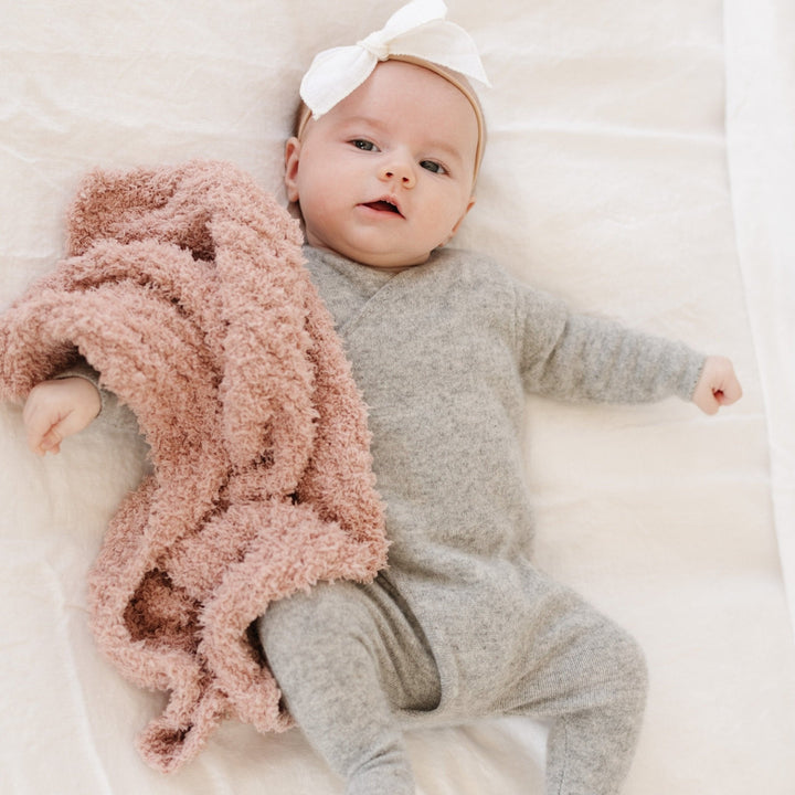 Every cuddle feels luxurious with the Saranoni Ribbed BAMBONI¨ Mini Blanket in Cameo, crafted for soft baby blankets.