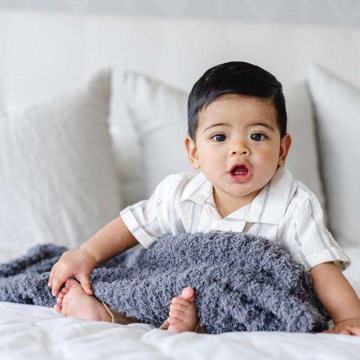 Saranoni Ribbed BAMBONI¨ Mini Blanket in Charcoal feels silky smooth and plush, a cozy choice for a baby boy blanket.