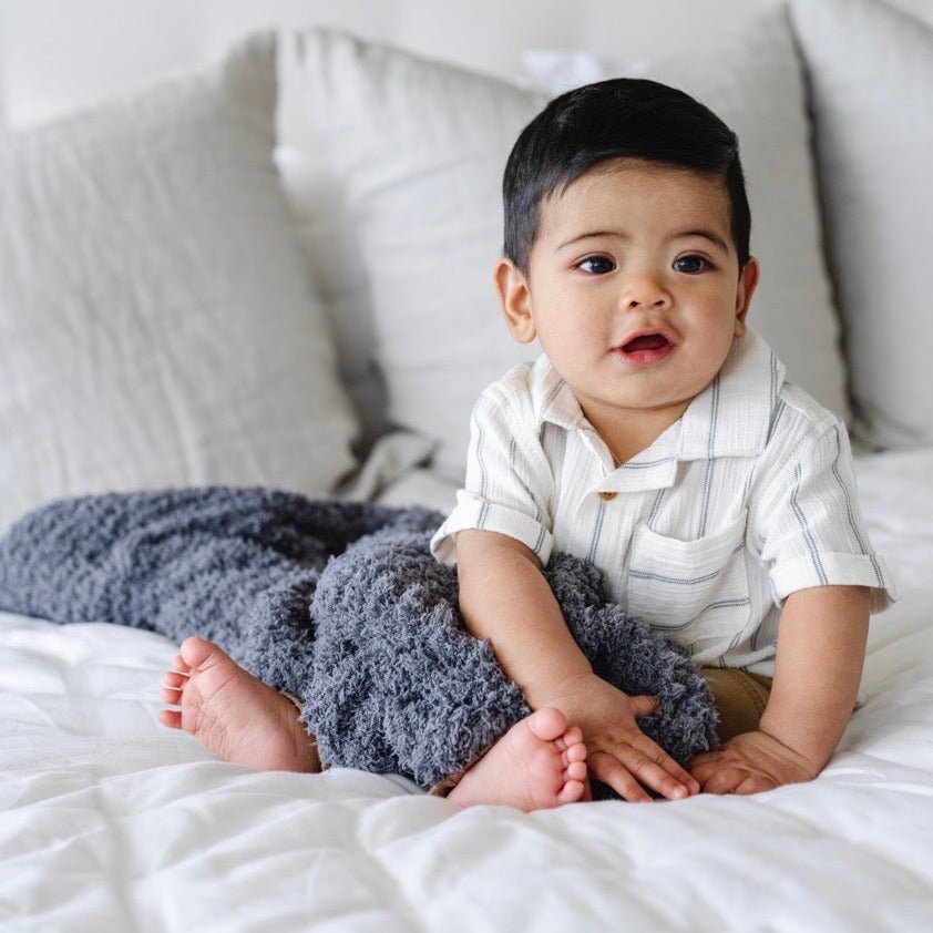 Designed for gentle comfort, the Saranoni Ribbed BAMBONI¨ Mini Blanket in Charcoal stands out as the best baby blanket.