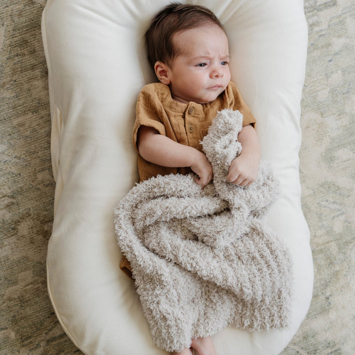 The Saranoni Ribbed BAMBONI¨ Mini Blanket in Moonbeam redefines comfort and quality, setting the bar for the best baby blanket.