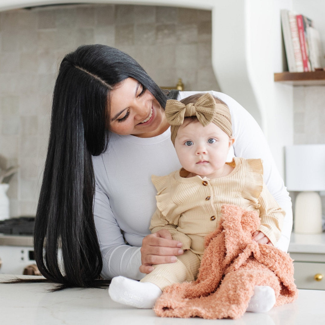 Sun-Kissed brings timeless coziness Ñ the Saranoni Ribbed BAMBONI¨ Mini Blanket offers plush warmth as a soft baby blanket.