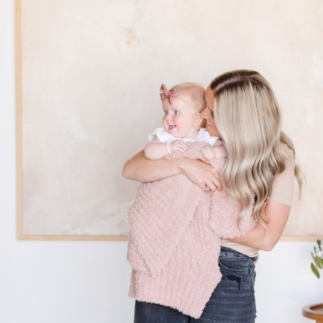 The Cameo Saranoni Ribbed BAMBONI¨ Receiving Blankets give your nursery a soft baby blankets upgrade.
