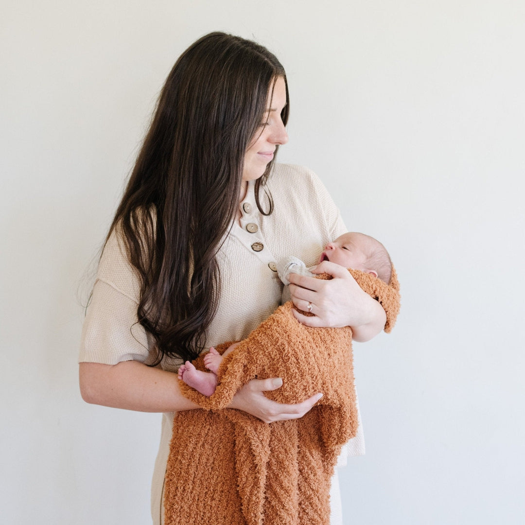 The Ginger Saranoni Ribbed BAMBONI¨ Receiving Blanket feels ultra plush, making it one of the Best baby blankets.