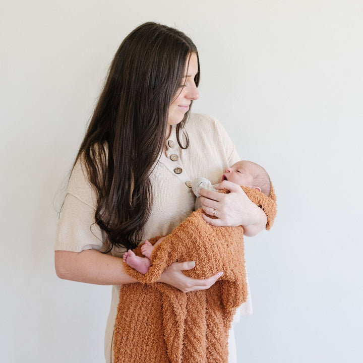 The Ginger Saranoni Ribbed BAMBONI¨ Receiving Blanket feels ultra plush, making it one of the Best baby blankets.